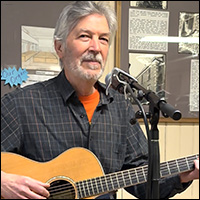 Jonathan Ochshorn with guitar, screenshot from music video for Ran Through My Mind